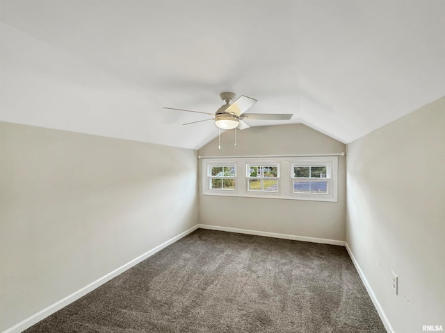 additional living space with ceiling fan, vaulted ceiling, and carpet flooring