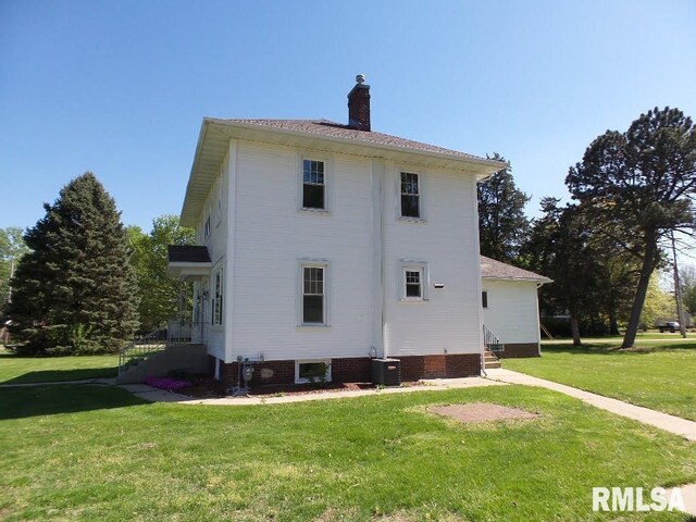 1201 Old Indiantown Rd, Henry, IL 61537 - rear view of house with a yard, a chimney, and entry steps