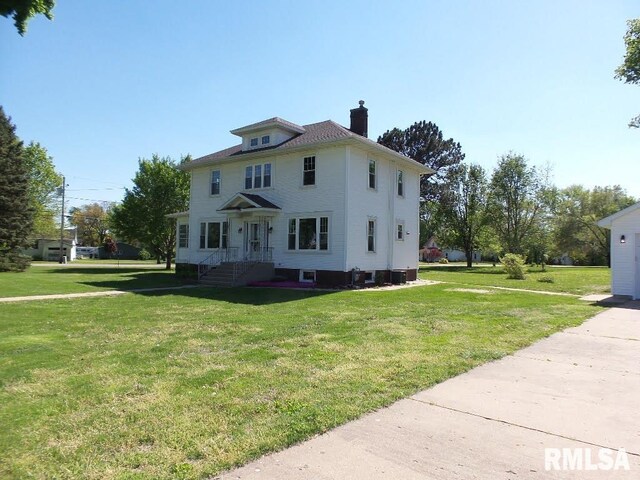 1201 Old Indiantown Rd, Henry, IL 61537 - rear view of house with a chimney and a yard