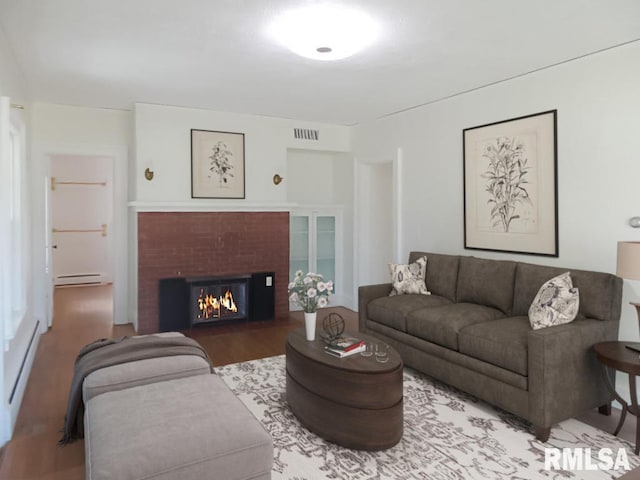 living room with hardwood / wood-style floors and baseboard heating