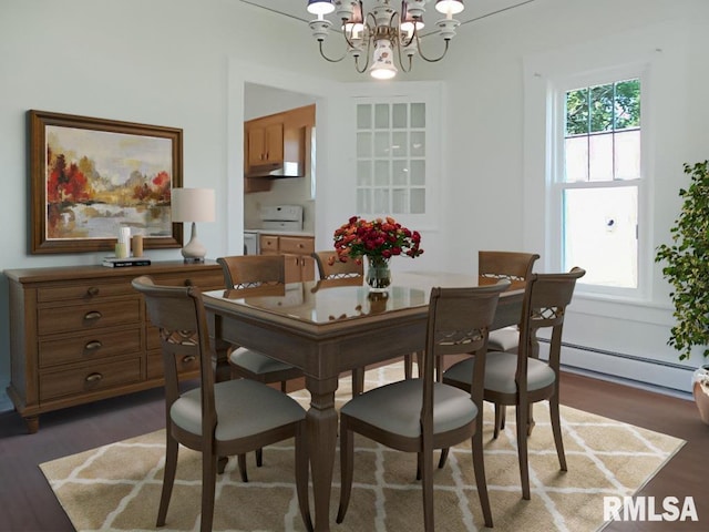 dining room featuring a baseboard heating unit, dark hardwood / wood-style floors, and an inviting chandelier