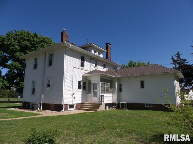 1201 Old Indiantown Rd, Henry, IL 61537 - traditional style home featuring a front lawn and a chimney