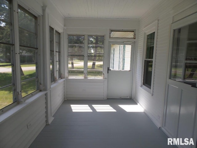 unfurnished sunroom with a wealth of natural light