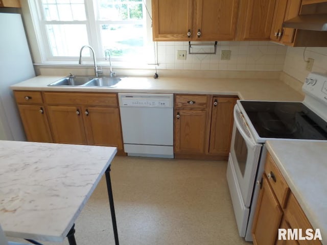 kitchen with white appliances, backsplash, extractor fan, and sink