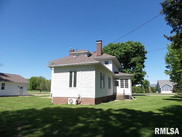 1201 Old Indiantown Rd, Henry, IL 61537 - american foursquare style home featuring a chimney and a yard