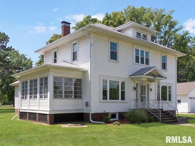 1201 Old Indiantown Rd, Henry, IL 61537 - back of property with a chimney, entry steps, cooling unit, and a yard