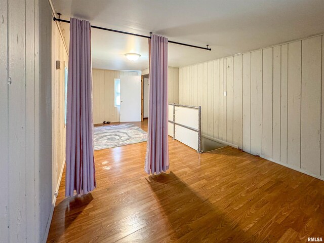 corridor featuring hardwood / wood-style floors