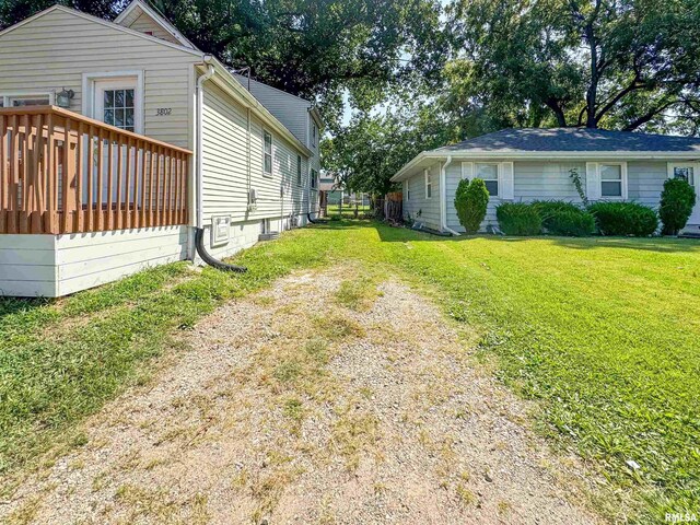 view of yard featuring a wooden deck