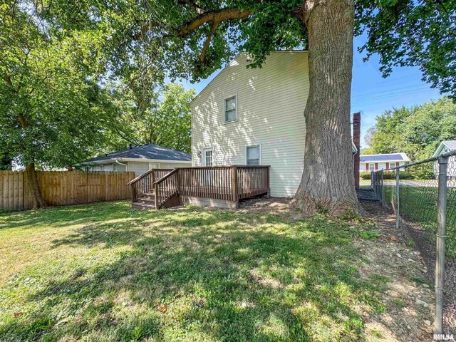 view of yard featuring a wooden deck