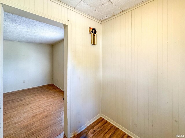 unfurnished room with hardwood / wood-style flooring