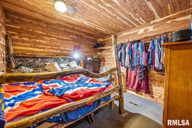 carpeted bedroom featuring wooden ceiling