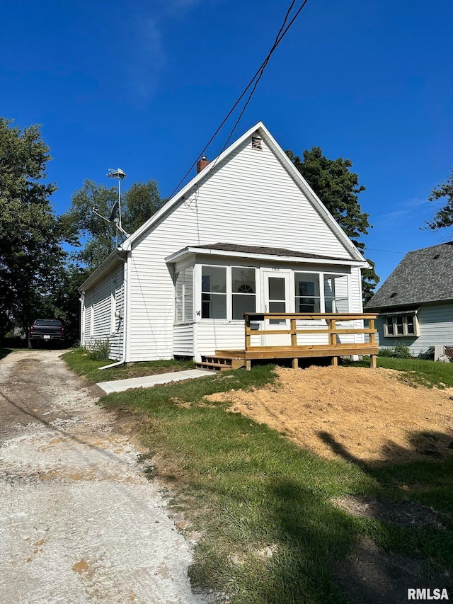 bungalow featuring a deck