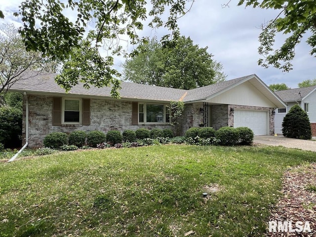 849 E Franklin St, Macomb, IL 61455 - ranch-style house featuring a garage, a front lawn, brick siding, and driveway