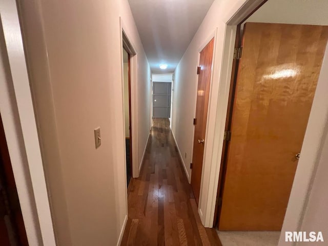 hallway featuring dark hardwood / wood-style flooring