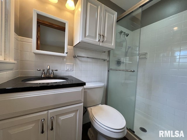 849 E Franklin St, Macomb, IL 61455 - bathroom featuring a shower stall, toilet, and vanity