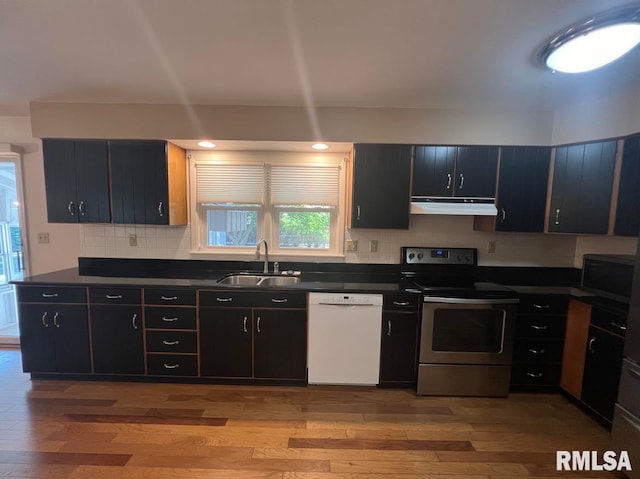 kitchen with light wood-type flooring, white dishwasher, electric stove, and sink