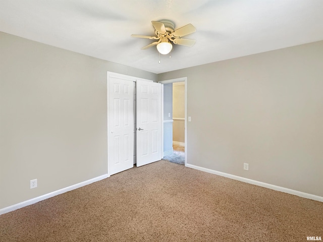 unfurnished bedroom featuring a closet, carpet flooring, and ceiling fan