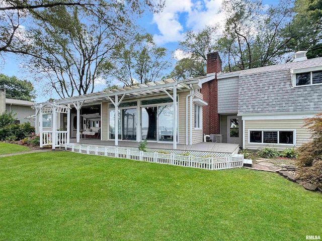 rear view of house featuring a pergola, a yard, and a patio area