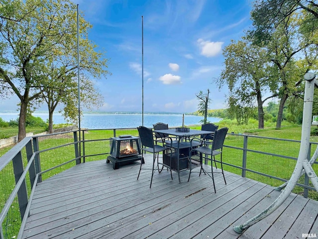 deck featuring a lawn and a water view