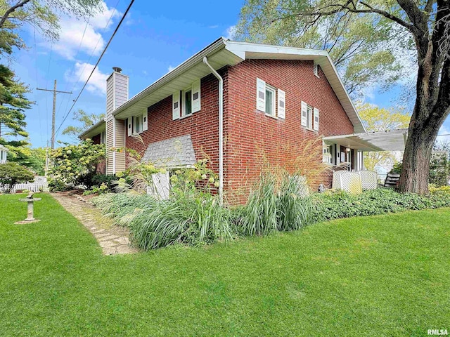 view of home's exterior with a yard