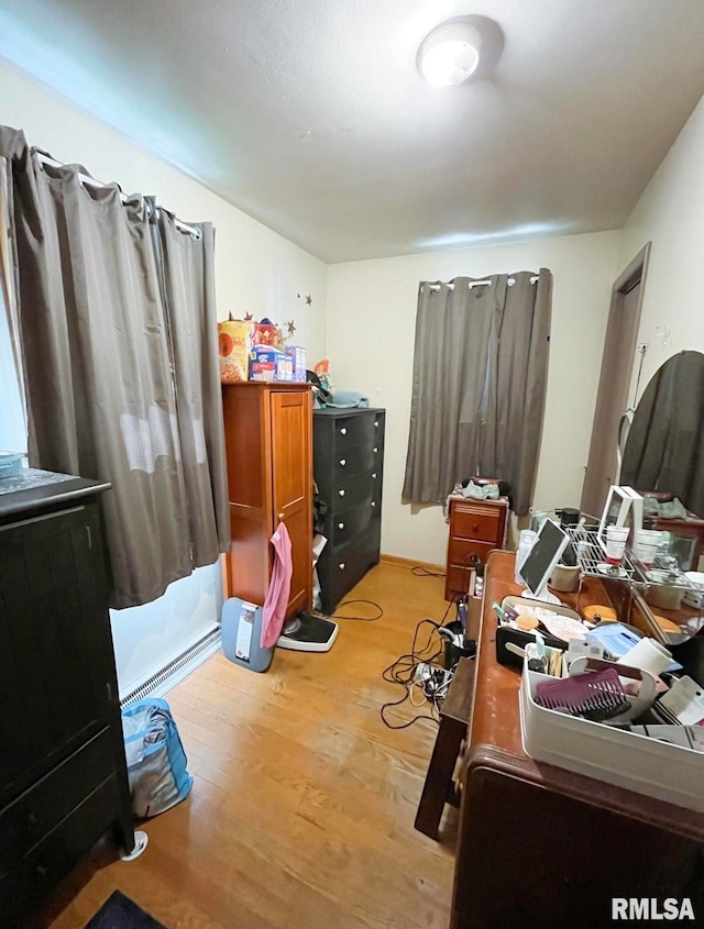 bedroom with light wood-type flooring