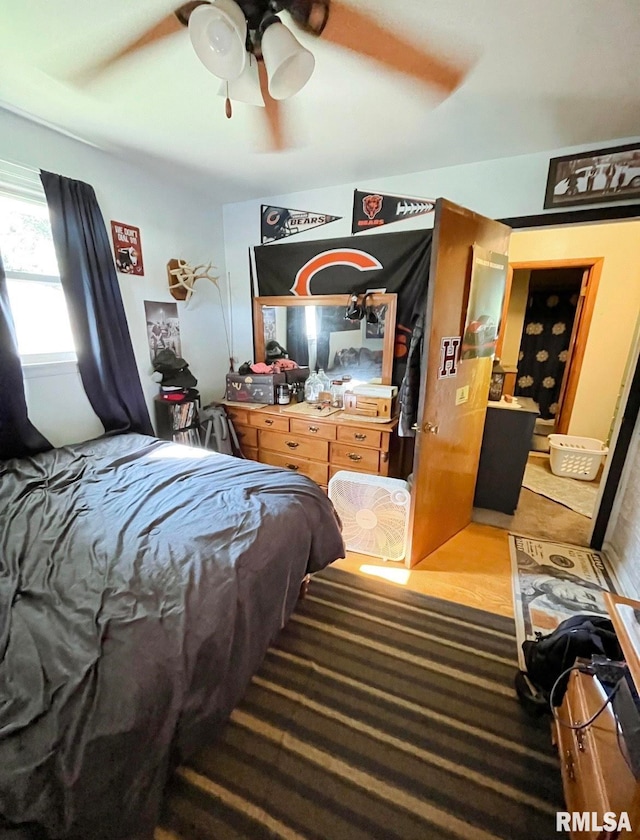 bedroom with ceiling fan and hardwood / wood-style flooring