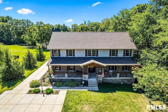 view of front of home with a front yard and covered porch