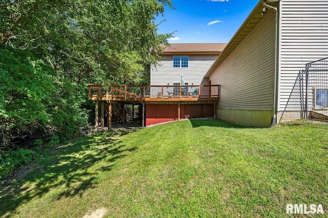 view of yard with a wooden deck