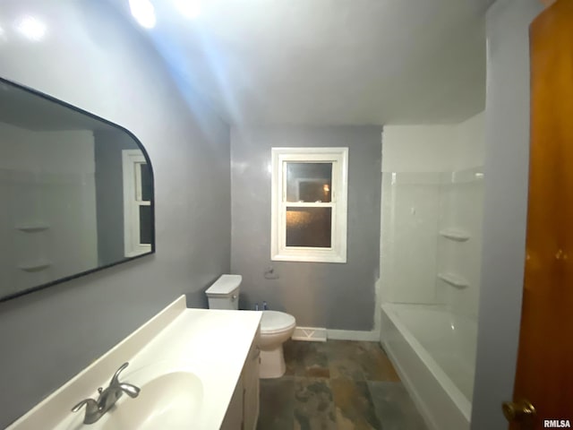 full bathroom featuring toilet, baseboards, and vanity