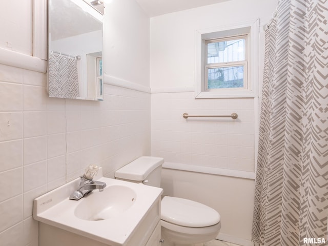 full bath with vanity, tile walls, curtained shower, and toilet