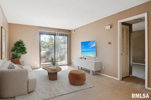 living room featuring light carpet