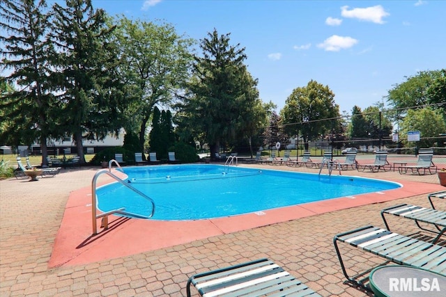 view of swimming pool featuring a patio