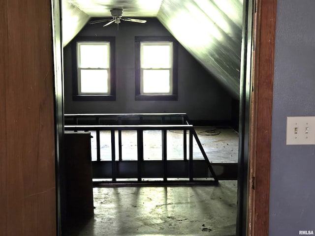 additional living space featuring lofted ceiling and ceiling fan