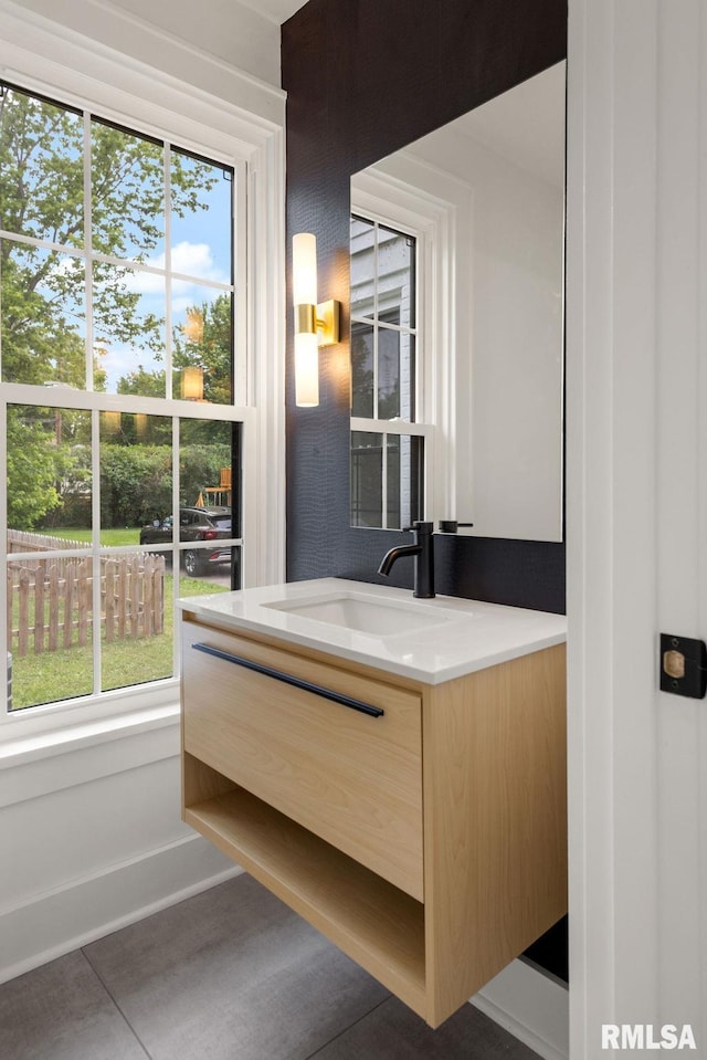 bathroom with vanity and tile patterned flooring