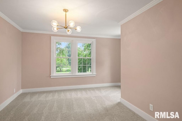 carpeted empty room featuring a chandelier, baseboards, and crown molding