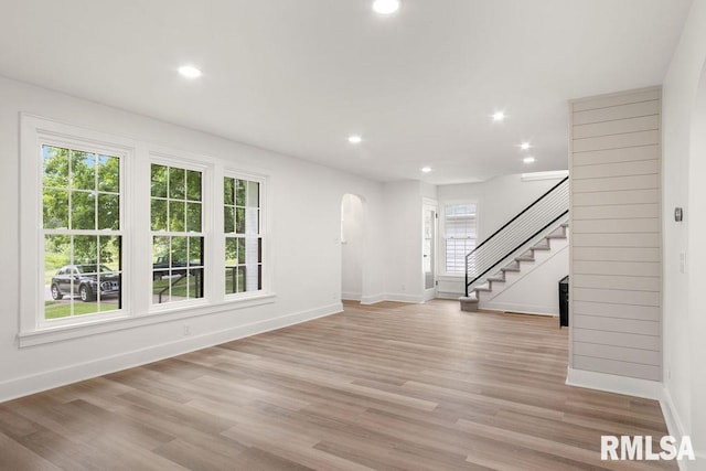 unfurnished living room with light wood-type flooring