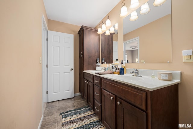 bathroom with vanity, tile patterned flooring, and ceiling fan