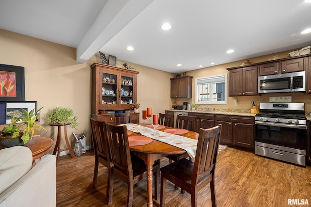 dining area with light hardwood / wood-style floors