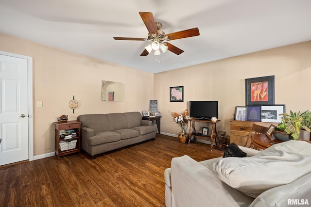 living room with ceiling fan and dark hardwood / wood-style flooring