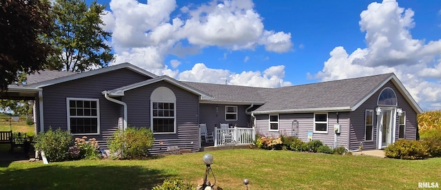 single story home with a front yard