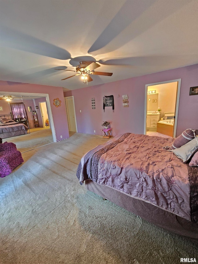 carpeted bedroom featuring ensuite bathroom and ceiling fan