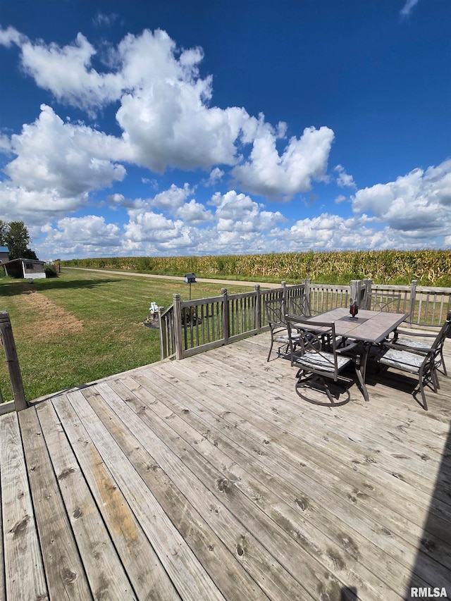 wooden terrace featuring a yard