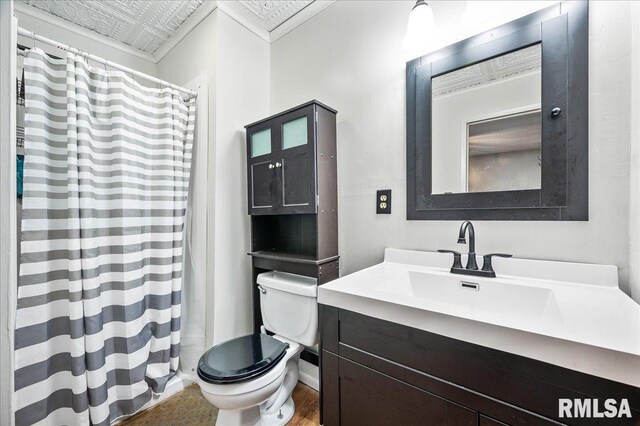 bathroom featuring toilet and vanity