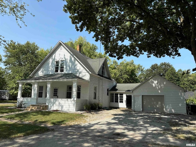 view of front of home with a porch and a garage