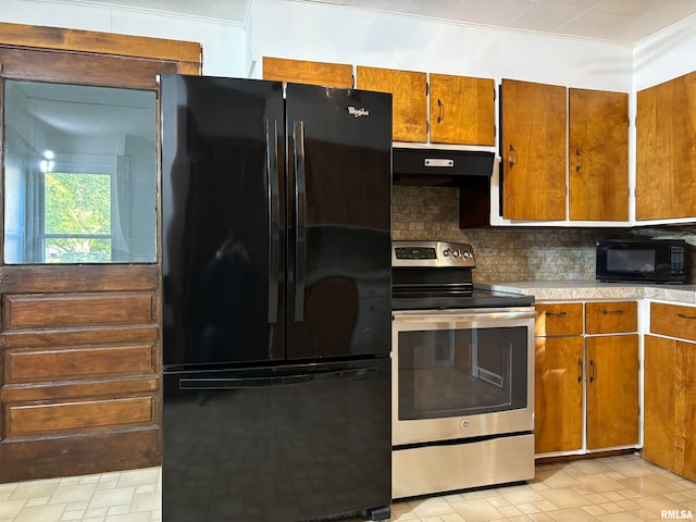 kitchen with ventilation hood, black appliances, crown molding, and tasteful backsplash