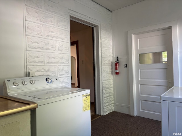 washroom featuring dark carpet and washer and clothes dryer