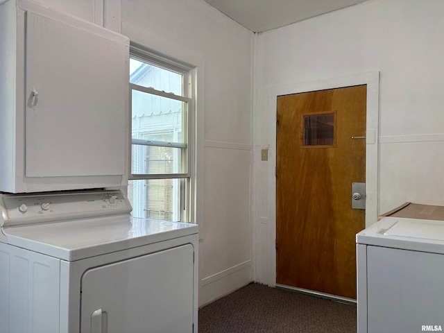 clothes washing area featuring cabinets, dark carpet, and independent washer and dryer