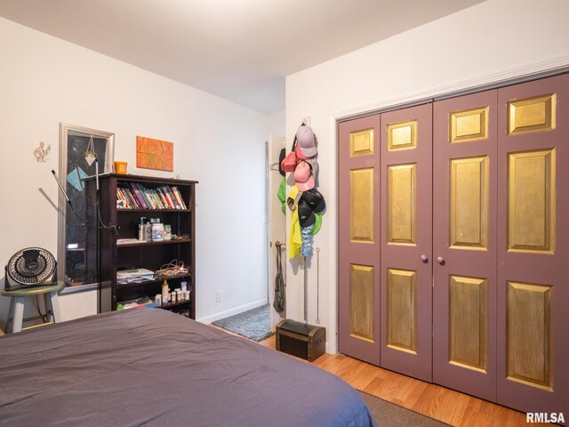 bedroom with a closet and light wood-type flooring