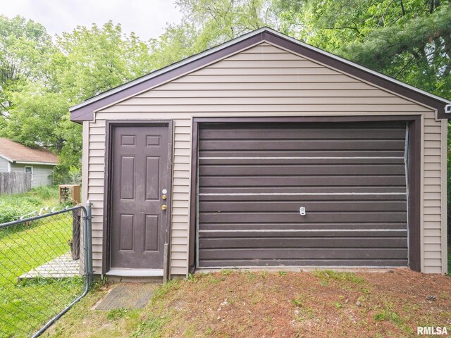 garage with a lawn