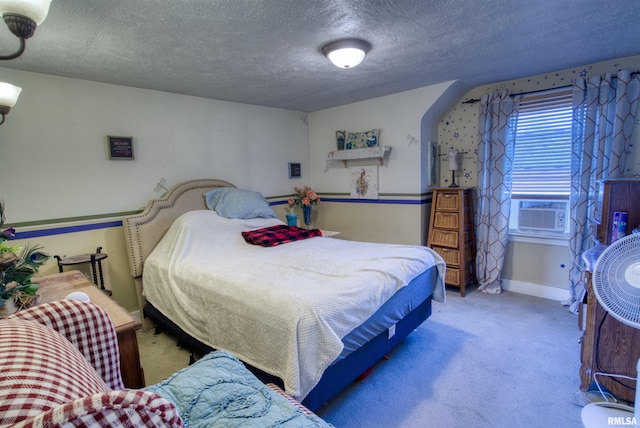 carpeted bedroom with cooling unit and a textured ceiling